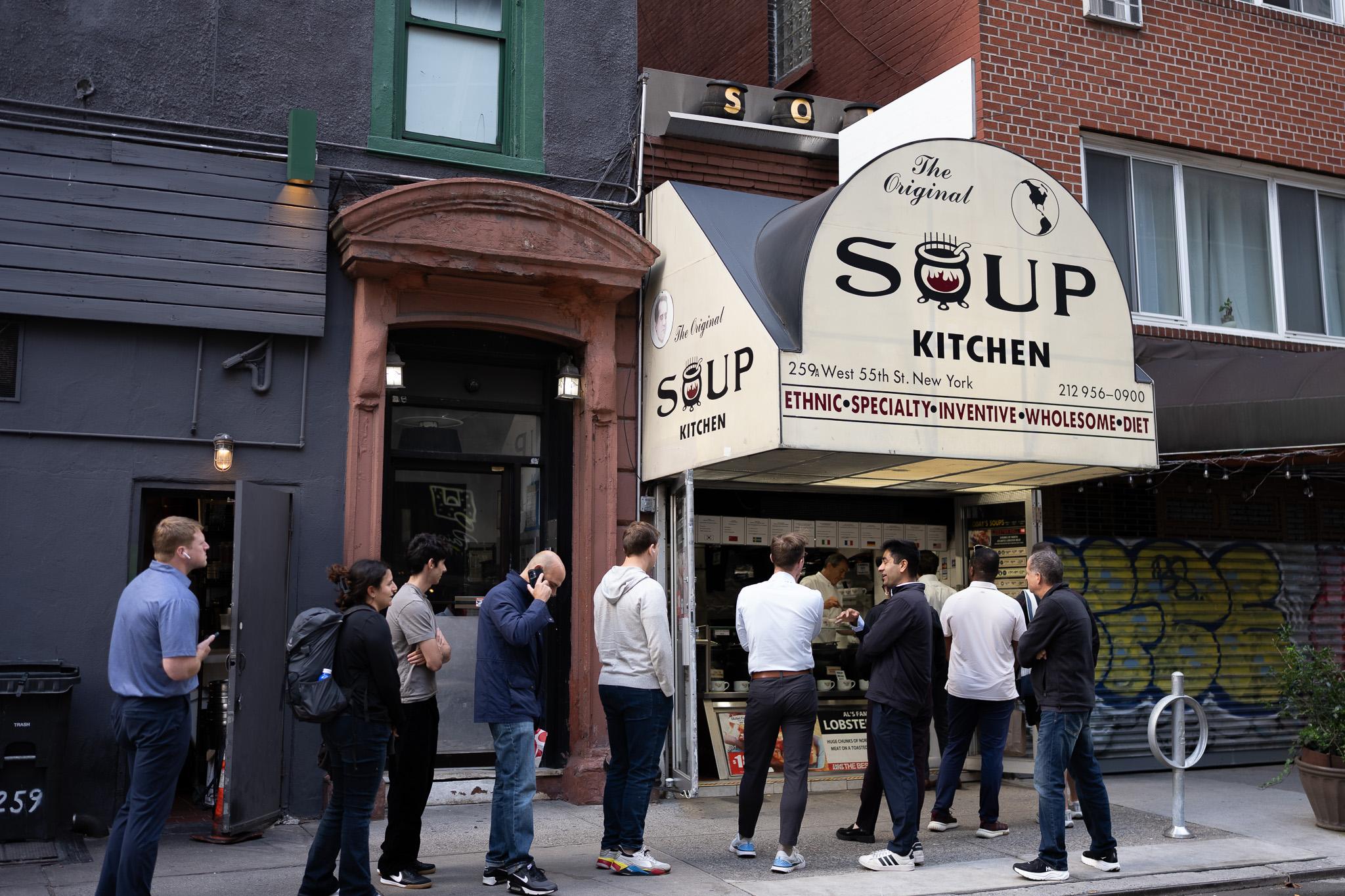 The Original Soup Kitchen awning on West 55th Street, with the lunch line outside