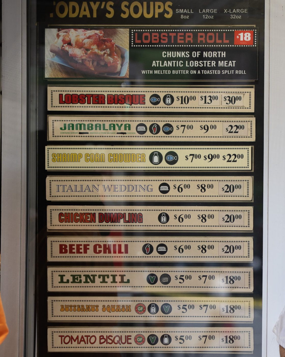 The Today's Soups board outside The Original Soup Kitchen, listing the day's soups in three sizes